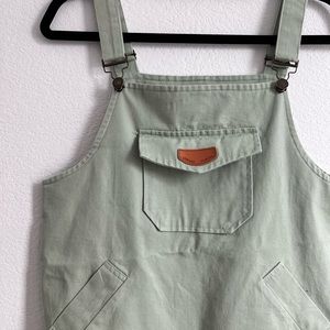 This is a short light green adjustable dress from Shein with pockets.